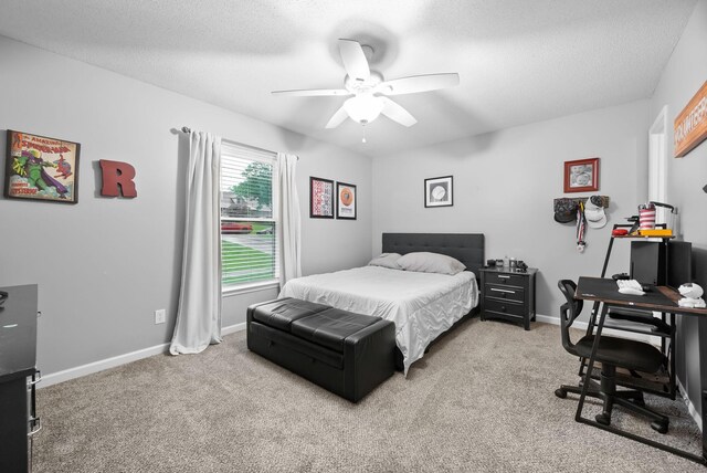 716 Ashwood Dr, Clarksville, TN 37043 - carpeted bedroom featuring a desk, baseboards, and ceiling fan