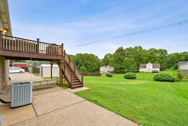 716 Ashwood Dr, Clarksville, TN 37043 - view of yard featuring central air condition unit, stairway, and a wooden deck