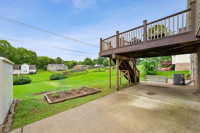 716 Ashwood Dr, Clarksville, TN 37043 - view of grassy yard featuring a vegetable garden, a patio, a wooden deck, and cooling unit