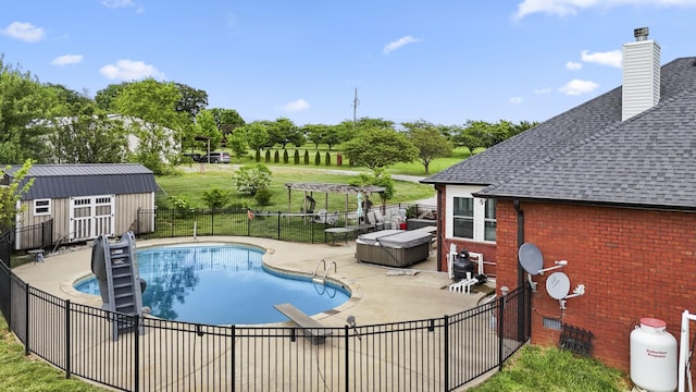 4484 N Pinson Rd, Portland, TN 37148 - view of swimming pool featuring fence, a patio, an outdoor structure, view of scattered trees, and a shed