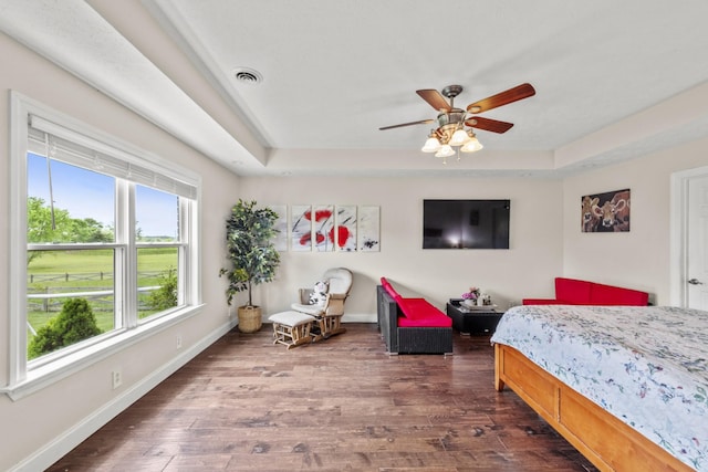4484 N Pinson Rd, Portland, TN 37148 - bedroom with dark wood finished floors, a raised ceiling, baseboards, and ceiling fan