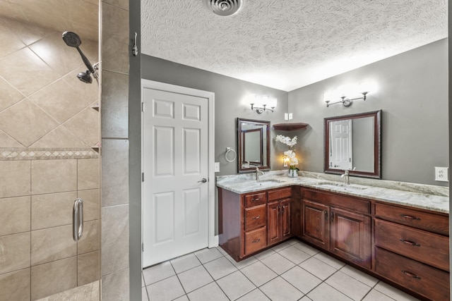 4484 N Pinson Rd, Portland, TN 37148 - full bathroom featuring a shower stall, tile patterned floors, double vanity, and a textured ceiling