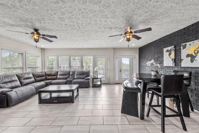 4484 N Pinson Rd, Portland, TN 37148 - living area featuring ceiling fan, a textured ceiling, and light tile patterned floors