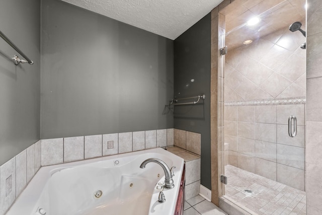 4484 N Pinson Rd, Portland, TN 37148 - bathroom featuring a shower stall, a whirlpool tub, tile patterned flooring, and a textured ceiling