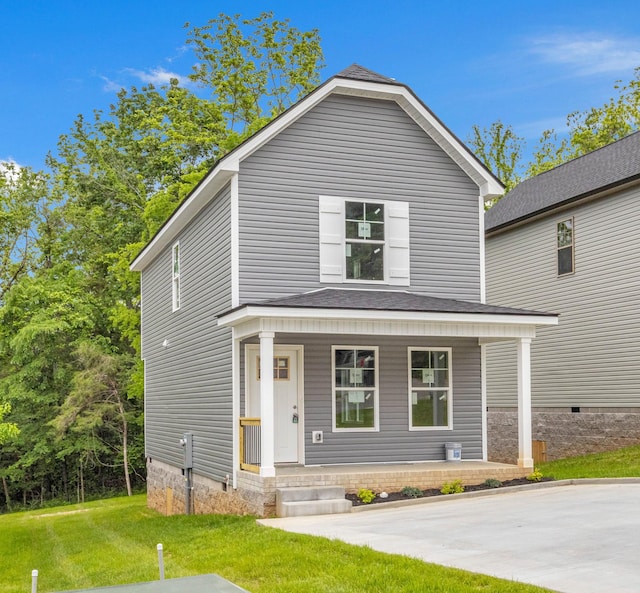 view of front of house featuring a porch, a front yard, and crawl space