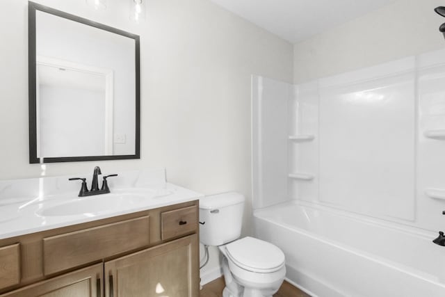 full bath with toilet, vanity, wood finished floors, and  shower combination