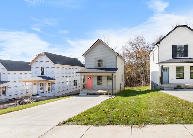 view of front of property featuring covered porch and a front yard
