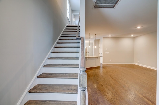 251 Grandstand Blvd, Gallatin, TN 37066 - staircase with wood finished floors, baseboards, and recessed lighting