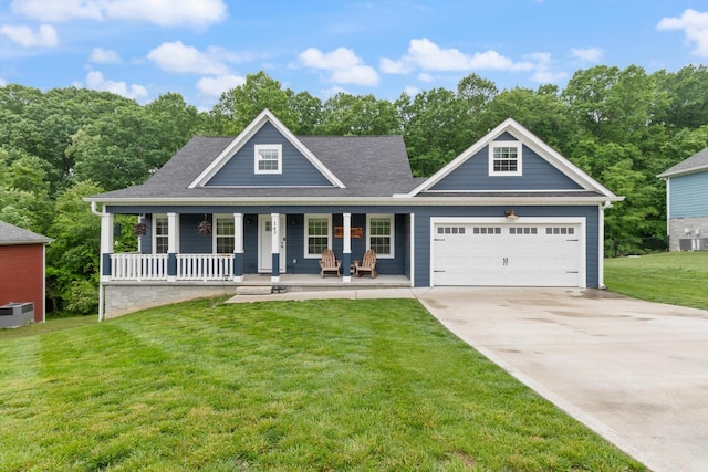145 Diane Loop, White Bluff, TN 37187 - view of front of house with concrete driveway, covered porch, an attached garage, a front lawn, and cooling unit