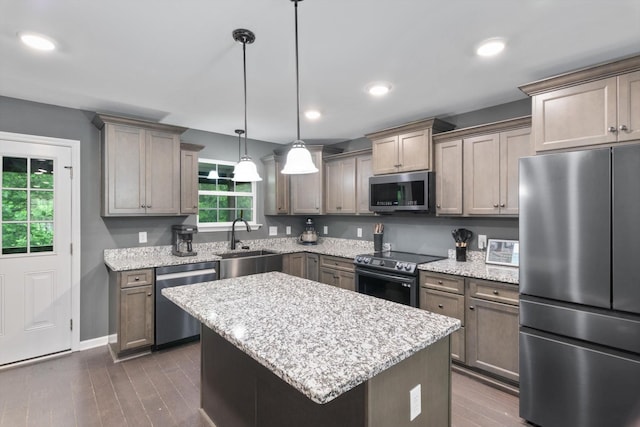 145 Diane Loop, White Bluff, TN 37187 - kitchen with appliances with stainless steel finishes, a sink, light stone countertops, dark wood-style flooring, and recessed lighting