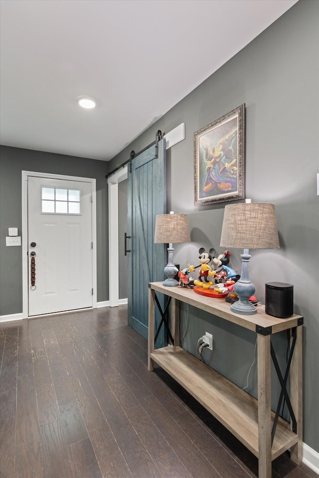 145 Diane Loop, White Bluff, TN 37187 - entryway featuring a barn door, baseboards, and wood finished floors