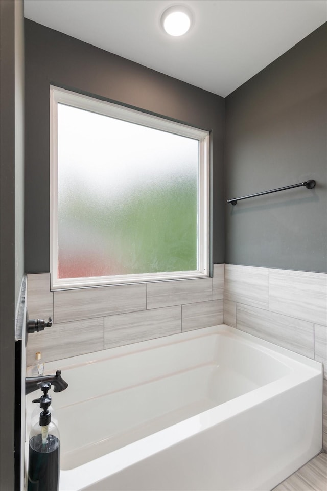 145 Diane Loop, White Bluff, TN 37187 - bathroom with a garden tub and tile walls