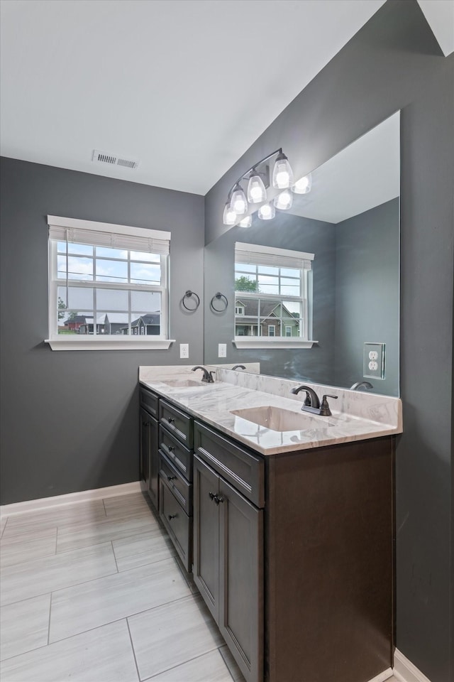 145 Diane Loop, White Bluff, TN 37187 - full bathroom featuring healthy amount of natural light, double vanity, and baseboards
