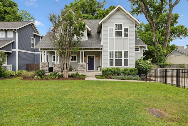 view of front of house with a porch and roof with shingles