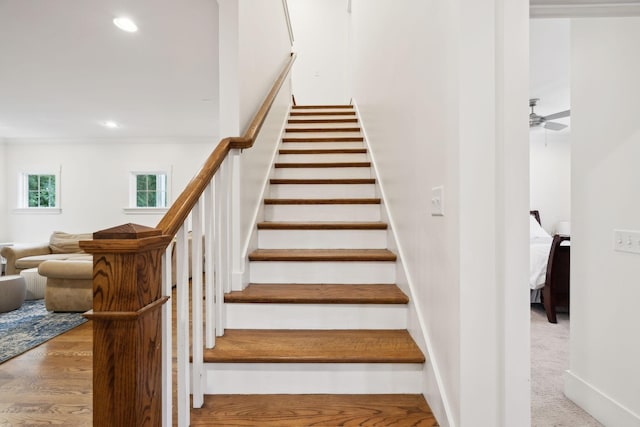 stairs featuring recessed lighting and ceiling fan