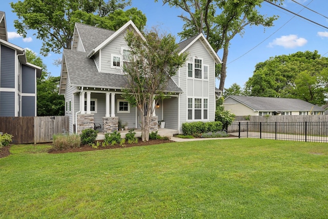 view of front of property featuring a shingled roof and covered porch