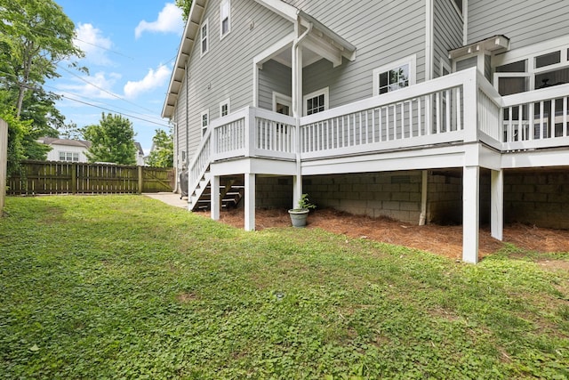 back of property featuring a deck and stairway