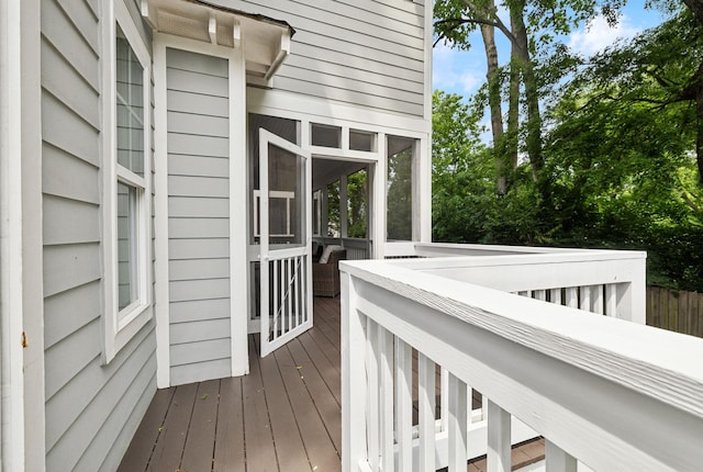 deck with a sunroom