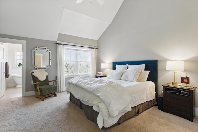 bedroom with light carpet, high vaulted ceiling, ensuite bathroom, ceiling fan, and baseboards