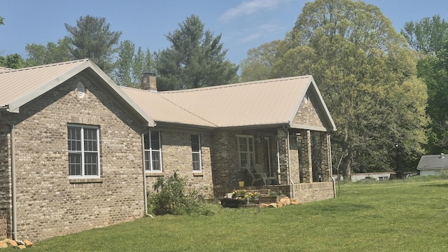 525527 Shady Grove Rd, Sequatchie, TN 37374 - rear view of property with brick siding, a yard, a chimney, and metal roof