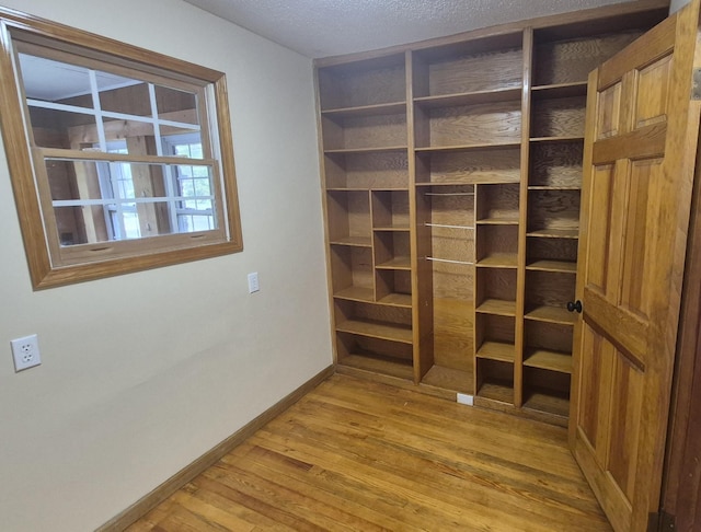 525527 Shady Grove Rd, Sequatchie, TN 37374 - interior space with baseboards, light wood finished floors, and a textured ceiling