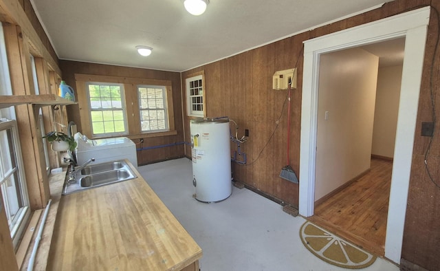 525527 Shady Grove Rd, Sequatchie, TN 37374 - kitchen featuring water heater, a sink, washer / clothes dryer, and wood walls
