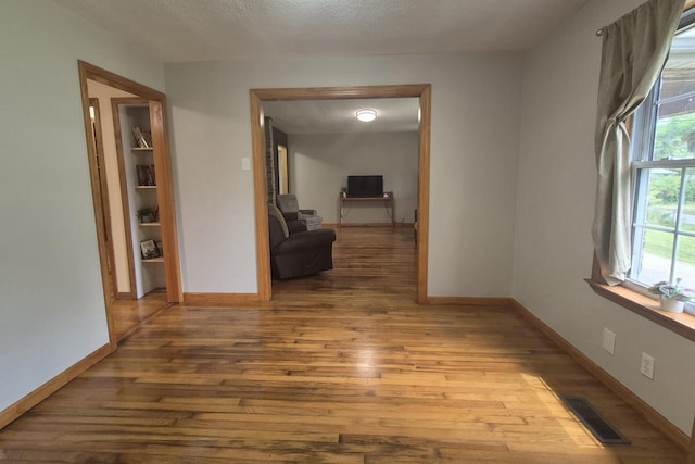 525527 Shady Grove Rd, Sequatchie, TN 37374 - hallway featuring wood finished floors, baseboards, and a textured ceiling