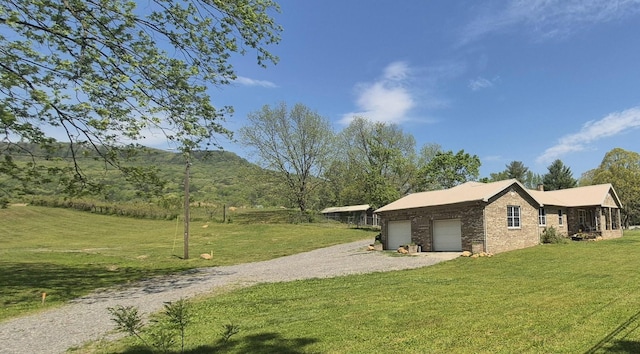 525 Shady Grove Rd, Sequatchie, TN 37374 - view of side of home with driveway, a lawn, brick siding, and a chimney