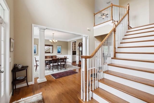 2041 Valley Brook Dr, Brentwood, TN 37027 - stairway featuring decorative columns, a high ceiling, wood finished floors, a chandelier, and crown molding