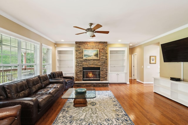 2041 Valley Brook Dr, Brentwood, TN 37027 - living area featuring ceiling fan, wood finished floors, crown molding, built in features, and a fireplace