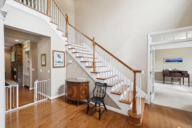 2041 Valley Brook Dr, Brentwood, TN 37027 - staircase featuring a high ceiling, wood finished floors, and baseboards