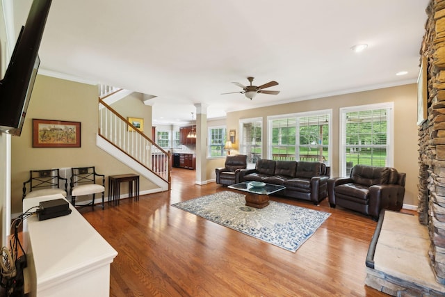 2041 Valley Brook Dr, Brentwood, TN 37027 - living room featuring ceiling fan, decorative columns, wood finished floors, plenty of natural light, and crown molding