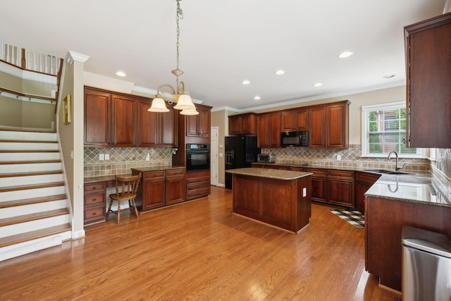 2041 Valley Brook Dr, Brentwood, TN 37027 - kitchen featuring black appliances, a sink, crown molding, decorative backsplash, and light wood-style floors