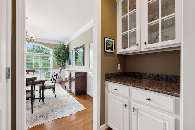 2041 Valley Brook Dr, Brentwood, TN 37027 - bar area with ornamental molding, light wood-style floors, and a chandelier