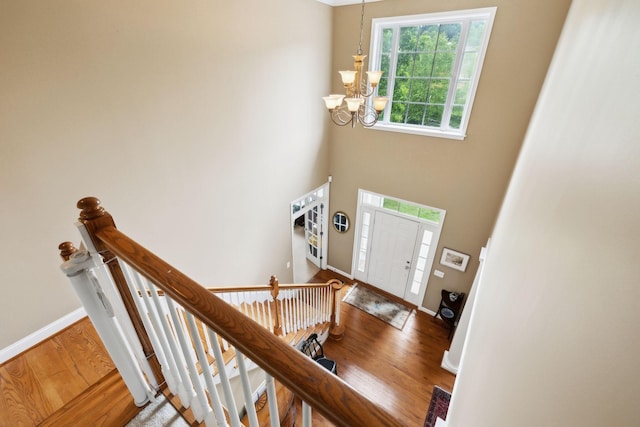 2041 Valley Brook Dr, Brentwood, TN 37027 - entrance foyer with a chandelier, wood finished floors, baseboards, and a towering ceiling