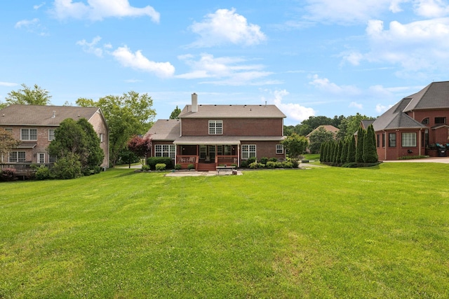2041 Valley Brook Dr, Brentwood, TN 37027 - back of property with a lawn, a patio, and a chimney