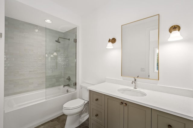full bath with toilet, shower / tub combination, vanity, and tile patterned floors