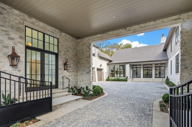 view of patio featuring decorative driveway and french doors