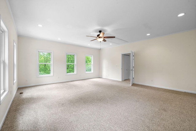 empty room featuring light colored carpet, ceiling fan, recessed lighting, and baseboards
