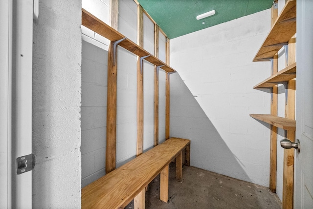 mudroom with concrete flooring