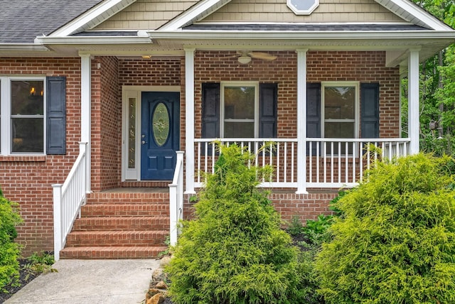 entrance to property featuring brick siding and a porch