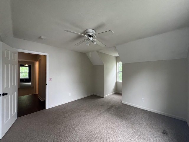105 Vernon Traylor Dr, Smyrna, TN 37167 - additional living space with healthy amount of natural light, dark carpet, ceiling fan, and vaulted ceiling