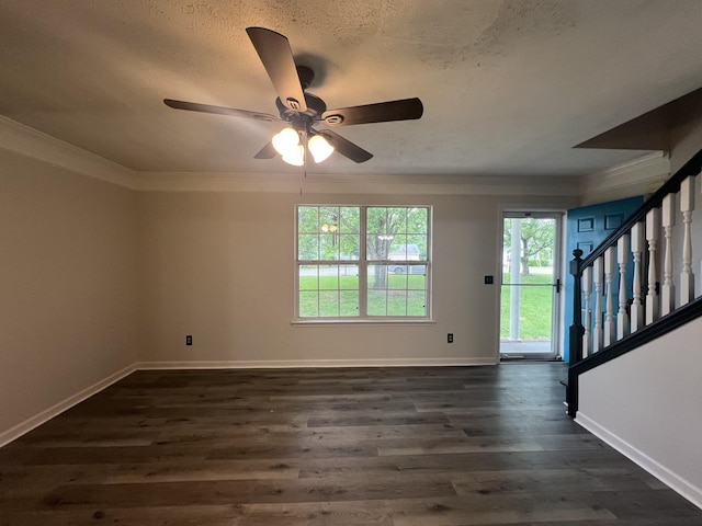 105 Vernon Traylor Dr, Smyrna, TN 37167 - unfurnished living room featuring ornamental molding, ceiling fan, stairs, dark wood-style floors, and a textured ceiling