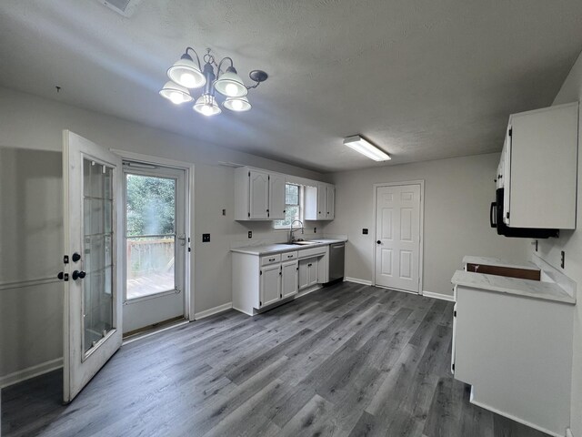 105 Vernon Traylor Dr, Smyrna, TN 37167 - kitchen with a sink, light countertops, white cabinets, and dark wood finished floors