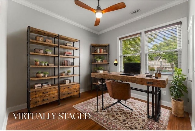 office area featuring a ceiling fan, wood finished floors, baseboards, and crown molding