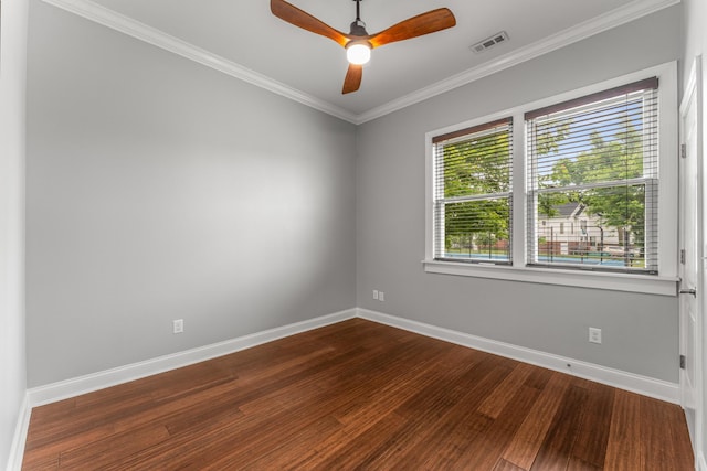 unfurnished room featuring baseboards, dark wood finished floors, a ceiling fan, and ornamental molding