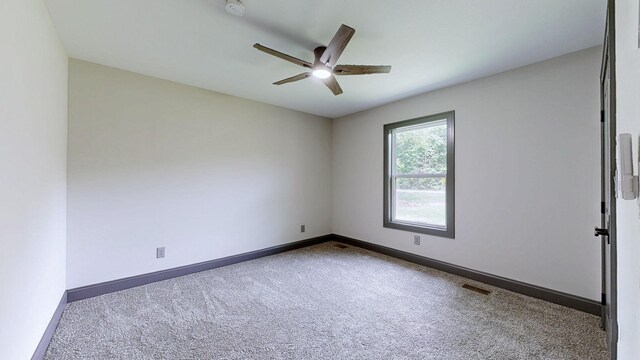 2038 Ogburn Chapel Rd, Clarksville, TN 37042 - carpeted empty room with a ceiling fan, baseboards, and a smoke detector