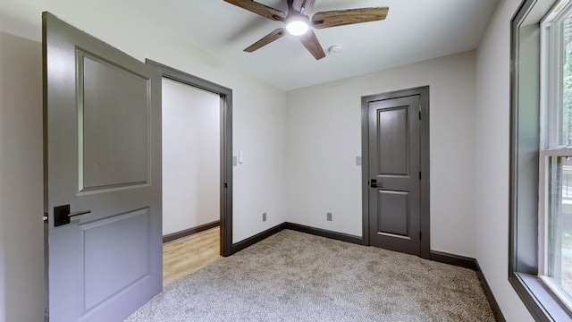 2038 Ogburn Chapel Rd, Clarksville, TN 37042 - unfurnished bedroom with light carpet, baseboards, and a ceiling fan