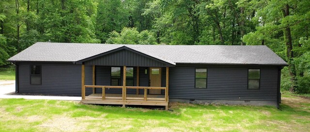 2038 Ogburn Chapel Rd, Clarksville, TN 37042 - back of property with crawl space, a lawn, covered porch, roof with shingles, and a view of trees