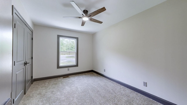 2038 Ogburn Chapel Rd, Clarksville, TN 37042 - unfurnished bedroom featuring carpet floors, baseboards, a ceiling fan, and a closet